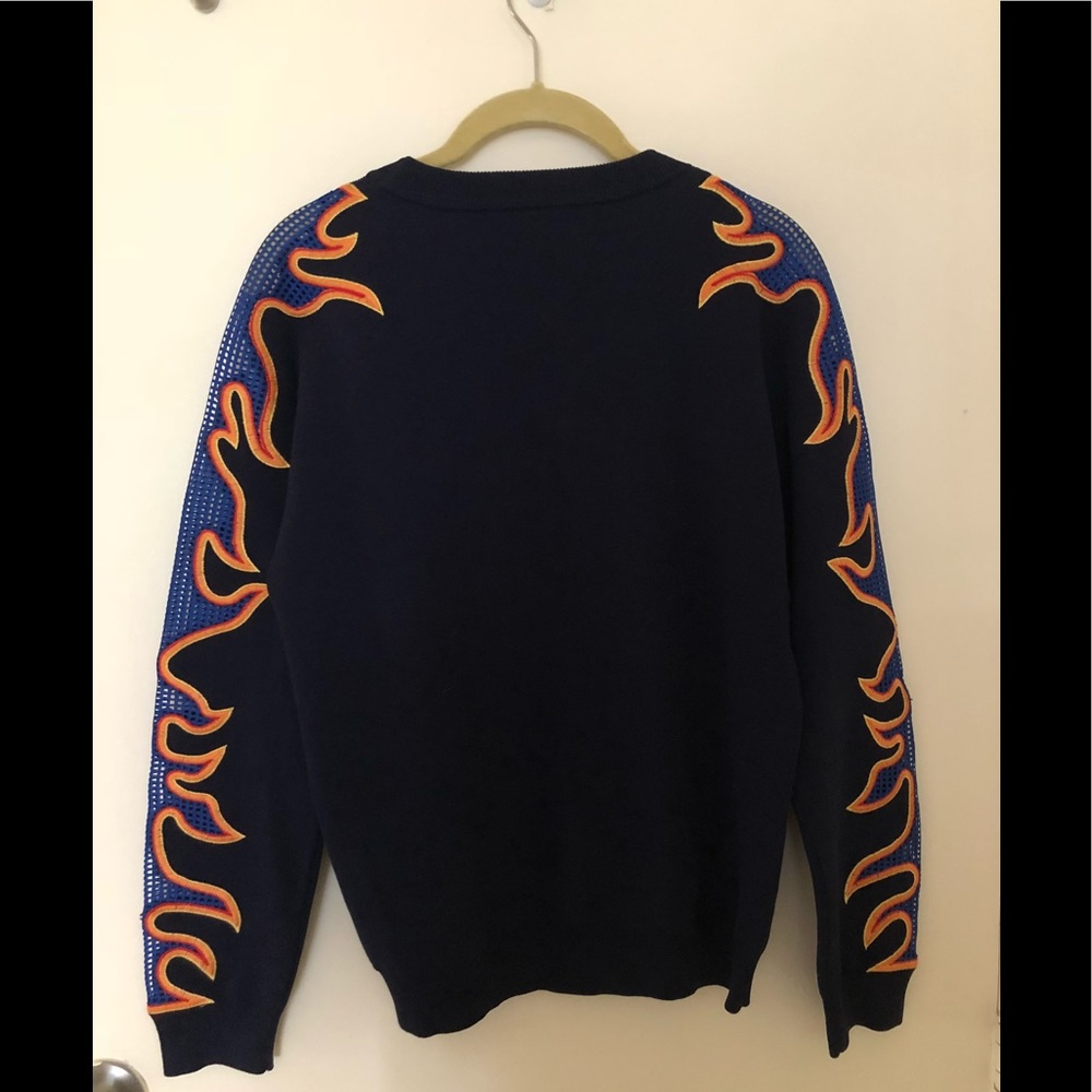 Navy blue sweater with flame details